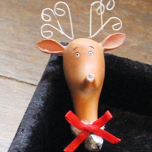Pin of Rudolf the red nosed Reindeer head with nose that lights up.