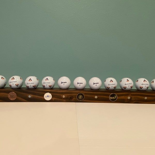 Golf ball display floating shelf, ball marker and golf divot display