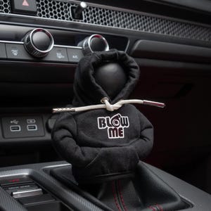 May include: Black hoodie gear shifter with the text "Blow Me" and a turbocharger graphic printed on the front.