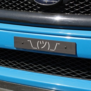 Billetworkz &quot;Shrug Guy&quot; License Plate Delete