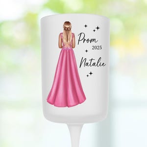 May include: White glass candle holder with a pink illustration of a woman in a dress. The text "Prom 2025 Natalie" is printed on the candle holder.