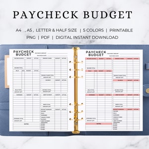 Può includere: Un pianificatore di budget per l'assegno di pagamento stampabile con sezioni per entrate, bollette, spese, pagamenti dei debiti e risparmi. Il pianificatore è progettato per l'uso con un raccoglitore e ha uno schema di colori rosa e bianco.