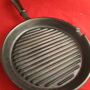 Vintage Cast Iron.Old Grill pan 24 cm. Cast iron pan. Ribbed kitchen. steak, barbecue, heavy, eternal.