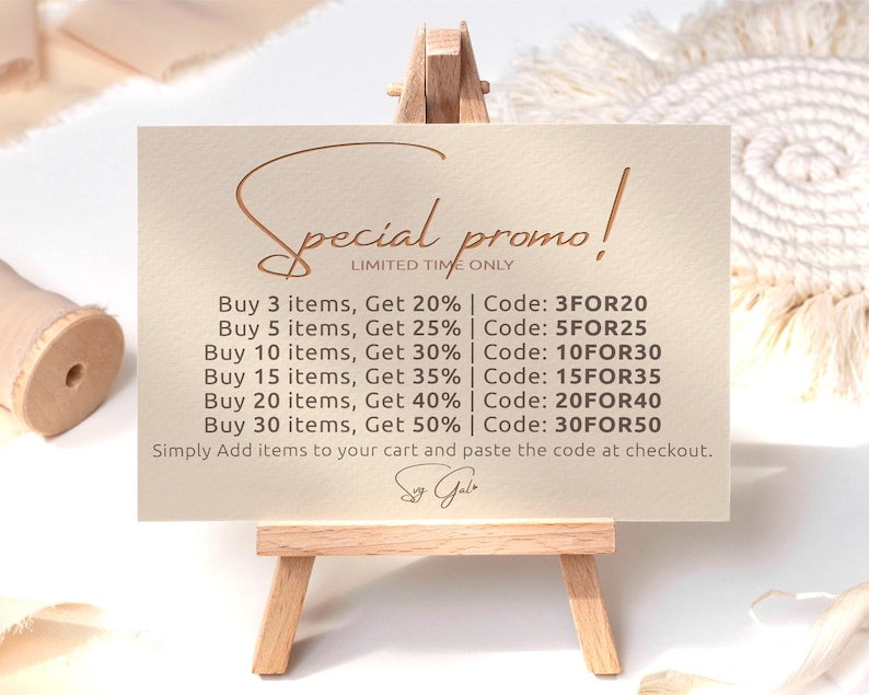 May include: A beige card with a handwritten "Special promo!" in brown script. The card lists discounts for buying multiple items, with codes for each discount. The text reads: "Buy 3 items, Get 20% | Code: 3FOR20, Buy 5 items, Get 25% | Code: 5FOR25, Buy 10 items, Get 30% | Code: 10FOR30, Buy 15 items, Get 35% | Code: 15FOR35, Buy 20 items, Get 40% | Code: 20FOR40, Buy 30 items, Get 50% | Code: 30FOR50. Simply Add items to your cart and paste the code at checkout."