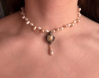 Collana con orologio a forma di sirena naufragata