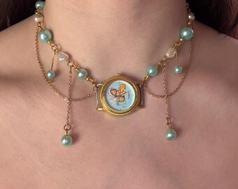 Goud- en lichtblauwe horlogeketting