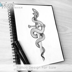 May include: A black and white tattoo design of a snake wrapped around a sword. The design is drawn on a white sheet of paper. The text "Tattoo Design For Sale" is written at the bottom of the page.