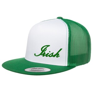 May include: White and green trucker hat with a green embroidered "Irish" logo. The hat has a mesh back and a snap closure.