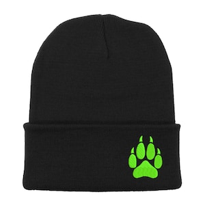 May include: Black beanie with a bright green bear paw print embroidered on the front.