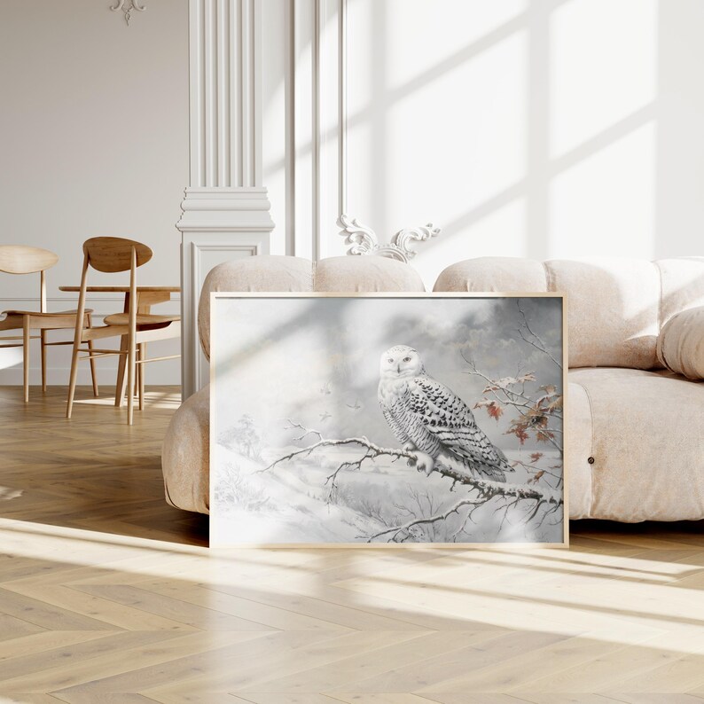 May include: A snowy owl perched on a branch in a wintry scene. The owl is white with black markings and has yellow eyes. The background is a soft, muted grey with hints of blue and white.