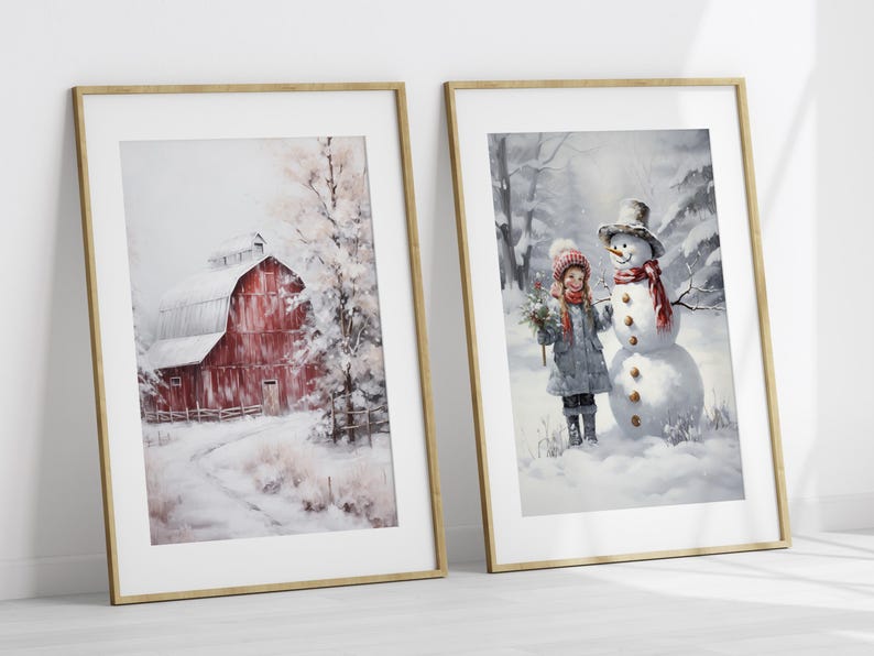 May include: Two framed winter-themed paintings. The first painting shows a red barn in a snowy landscape. The second painting shows a girl in a red hat and blue coat standing next to a snowman.