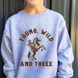Young, Wild, and Three Birthday Shirt Western Graphic Tee Western Toddler Shirt Toddler Horse Shirt Kids Horse Shirt Cowgirl Shirt Rodeo