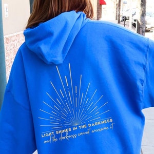 Light Shines in the Darkness Hoodie Sun Shirt Christian Shirts Be the Light Bible Verse Shine Your Light Scripture Faith Based Sweatshirt