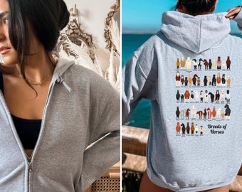 May include: A gray hooded sweatshirt with a graphic of different horse breeds on the back. The text "Breeds of Horses" is printed below the graphic.