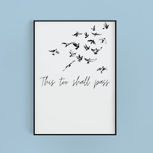 May include: Black and white print of a flock of birds flying away with the text "This too shall pass" below.