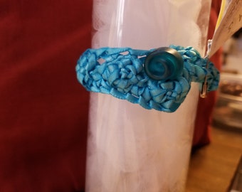 Light blue bracelet with button closure