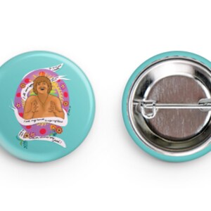 May include: A turquoise button with a colorful illustration of a man with the text "I took my boyfriend to a cage fight and he said it was very good!"