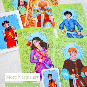 May include: Set of 6 illustrated cards featuring characters from the Narnia series. Each card features a different character with a unique background and a word describing their personality. The words are "valiant", "gentle", "just", "magnificent", and "brave".