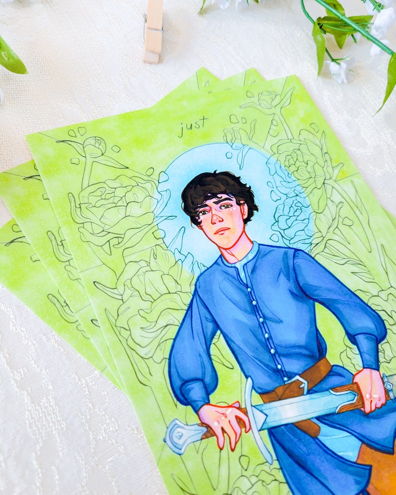 May include: A watercolor illustration of a young person with short brown hair wearing a blue shirt and holding a sword. The background is a green and white floral pattern with the word "just" written in the top center of the image.