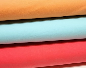Cotton Spandex Fabric Solids, Vibrant colors of Tangerine, Aqua Blue, and Pink Coral. Sold by the 1/2 yard.
