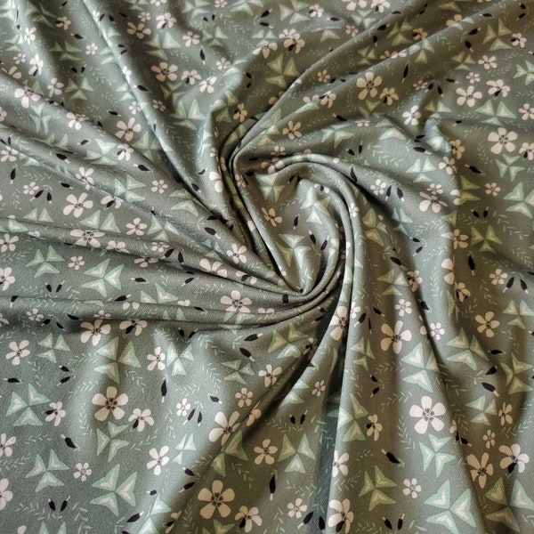 Double Brushed Poly Fabric, Pretty and Soft Sage Shamrock and Light Pink Floral Print. DBP KNIT, 4 -Way Stretch. Sold by the 1/2 Yard