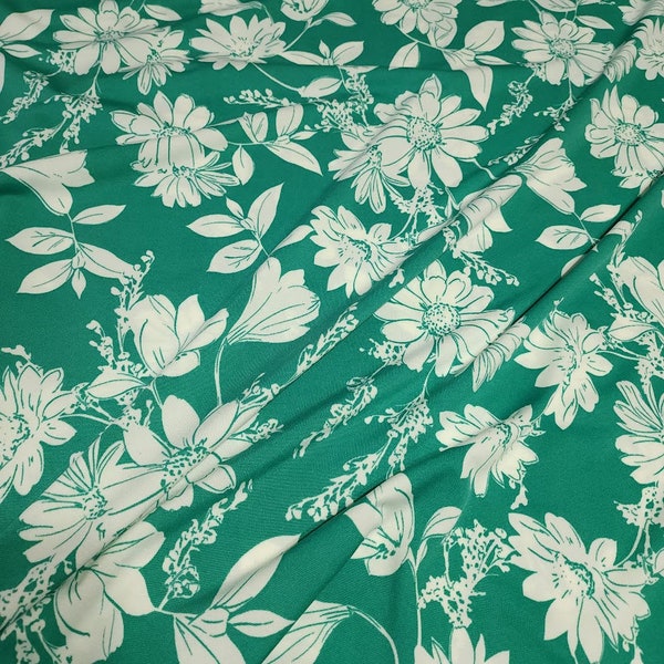 Poly Spandex Knit White Floral on Green, Nice and Flowy Drape, Perfect for Sewing Apparel, 2 Way Stretch Knit Fabric, Sold By The 1/2 Yard