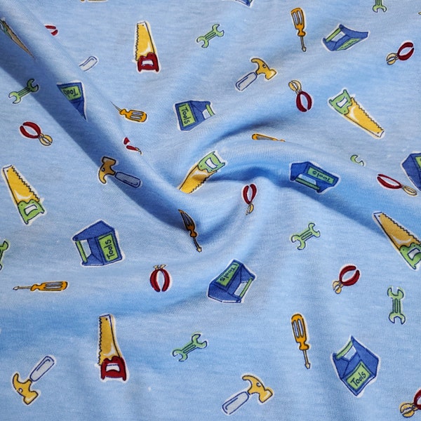 Cotton Blend Stretch Knit T-Shirt Fabric, Construction Tools on Blue, Great for T-shirts and more. 2-way stretch. Sold by the 1/2 yard