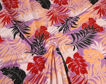 Tissu poly tropical brossé double, tricot extensible, feuilles d'île, toucher doux avec beau drapé. Vendu par 1/2 mètre.