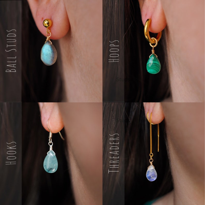 May include: Four different styles of earrings with gemstone drops. The styles are ball studs, hoops, hooks, and threaders. The gemstones are labradorite, malachite, aquamarine, and moonstone.