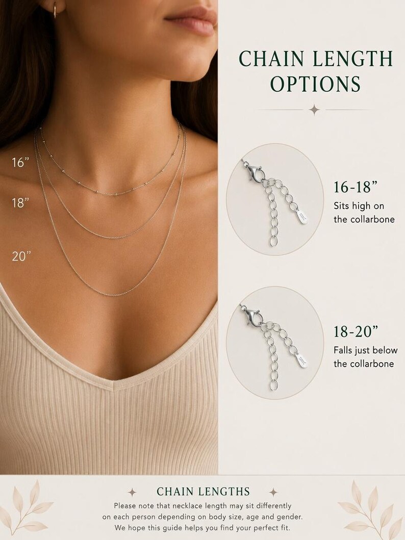 May include: A silver-toned chain necklace shown in three lengths: 16 inches, 18 inches, and 20 inches. The image includes text labels for chain length options, showing 16-18 inch and 18-20 inch adjustable clasps with extender chains.