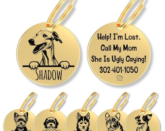 May include: A collection of round gold-colored metal pet ID tags featuring black laser-engraved illustrations of various dog breeds peeking over a horizontal line. Each tag includes a name and a split ring. One tag displays the text: Help! I'm Lost. Call My Mom She Is Ugly Crying! 302-401-1050.