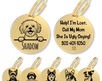 May include: Gold-toned circular metal pet ID tags featuring engraved black illustrations of various dog breeds peeking over a horizontal line. Each tag includes a name and a gold split ring. One tag displays the text: Help! I'm Lost. Call My Mom She Is Ugly Crying! 302-401-1050.