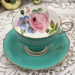 Paragon aqua green/blue with cabbage rose and blue flower double warrant corset tea cup and saucer set. Vintage bone china England
