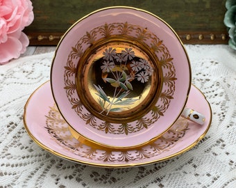 Royal Grafton gold center and pink with white flowers tea cup and saucer set. Vintage bone china England