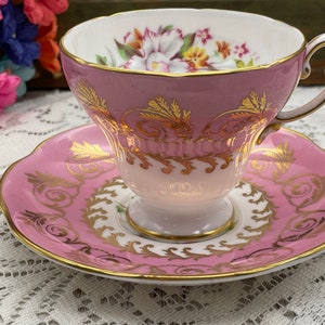 EB Foley pink and white with gold garland and orchid flowers footed tea cup and saucer set. Vintage bone china England