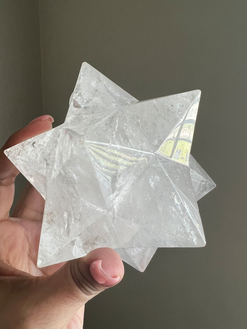 This is an XL genuine Clear Quartz Stellated Dodecahedron that has been cleansed and infused with Reiki. This gorgeous Clear Quartz Star is big and weighs 1.75 lbs! This is Sacred Geometry and Metatron's Cube.