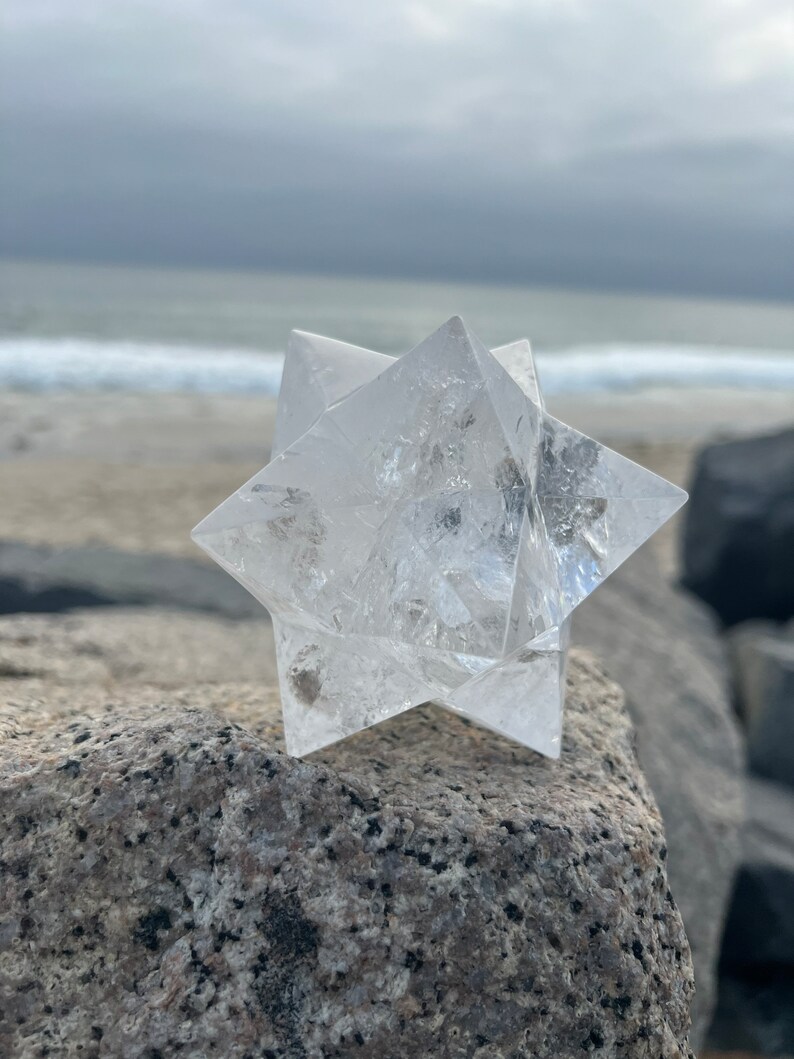This is an XL genuine Clear Quartz Stellated Dodecahedron that has been cleansed and infused with Reiki. This gorgeous Clear Quartz Star is big and weighs 1.75 lbs! This is Sacred Geometry and Metatron's Cube.