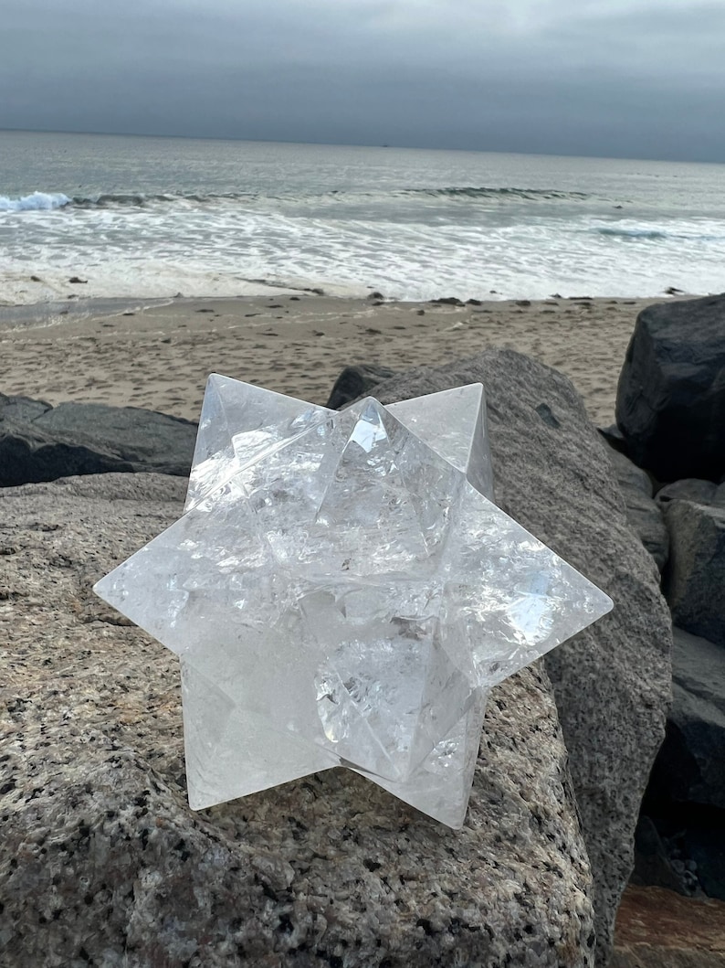 This is an XL genuine Clear Quartz Stellated Dodecahedron that has been cleansed and infused with Reiki. This gorgeous Clear Quartz Star is big and weighs 1.75 lbs! This is Sacred Geometry and Metatron's Cube.