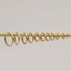 Orecchini a cerchio in oro massiccio 14 carati da 4,0 mm 4,5 mm 5,0 mm 5,5 mm 6,0 mm 6,5 mm 7,0 mm 8,0 mm 9,0 mm 10 mm 11 mm 12 mm. immagine 1