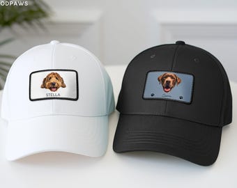 May include: A white baseball cap and a black baseball cap, each featuring a rectangular patch on the front. The white cap displays a golden doodle illustration with the text STELLA. The black cap shows a brown dog illustration with the text Sierra.