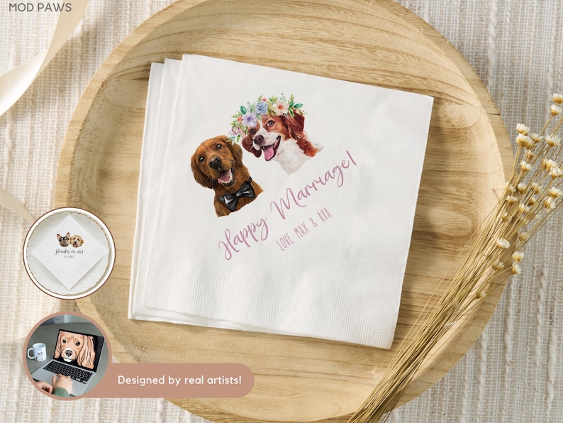 May include: White paper napkins with watercolor illustrations of two dogs. One dog wears a bow tie, the other a floral crown. The words "Happy Marriage!" and names are written in a cursive font. The napkins are on a wooden tray.