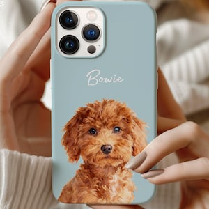 May include: A light blue phone case featuring a portrait of a brown poodle with the name "Bowie" in white script. The case has a glossy finish and is designed for a smartphone with multiple camera lenses.