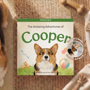 Può includere: Un libro per bambini intitolato "The Amazing Adventures of Cooper" con un'illustrazione di Corgi. La copertina del libro ha un bordo verde e il testo "MODPAWS". È disponibile un'opzione di illustrazione personalizzata, con una piccola immagine di un Corgi.