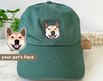 May include: A green baseball cap with an embroidered image of a dog's face. The text "your pet's face" is below the image.
