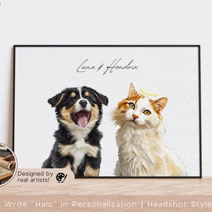 May include: A framed print featuring a black and tan puppy with its tongue out and a cat with a halo. The names "Luna & Hendrix" are written above the animals. The text "Designed by real artists!" is also visible.