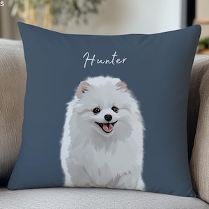 May include: A square throw pillow with a dark blue background featuring a white, fluffy Pomeranian dog illustration centred on the front. Above the dog, the name Hunter is printed in a white, cursive script font. The top left corner displays the text MODPAWS.