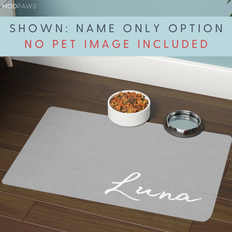 May include: A grey pet food mat with the name "Luna" in white script. A white ceramic bowl filled with pet food and a stainless steel bowl are on the mat. Text at the top reads "SHOWN: NAME ONLY OPTION NO PET IMAGE INCLUDED."