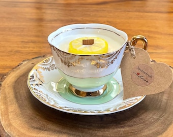 Pretty handmade lemon tea  ‘teacup’ candle.  Scented with lemon with wax lemon slice. Unusual gift.