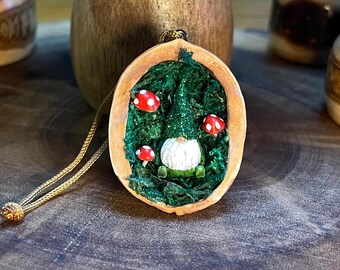 Walnut shell bearded gnome in a mushroom grove, rustic tree decoration. Unique addition to your tree.