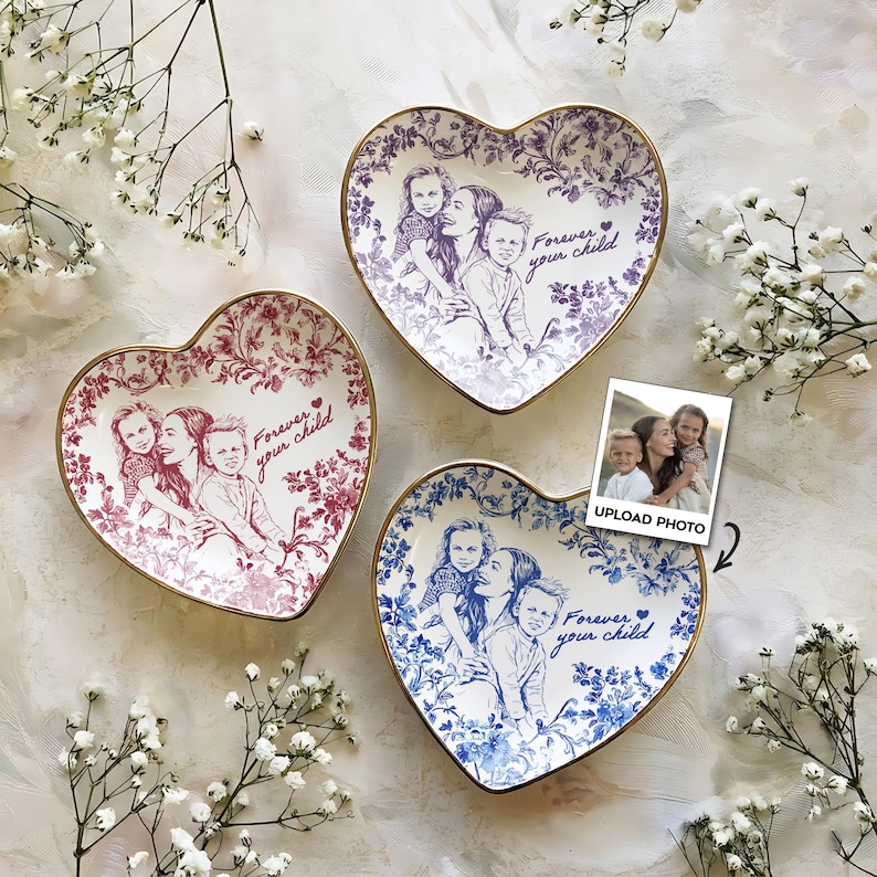 May include: Three heart-shaped ceramic dishes with gold rims, each featuring a family photo and the text "Forever your child." The dishes are in shades of red, purple, and blue, with floral patterns.